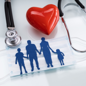 Family of four silhouette in blue on mask with stethoscope and red heart