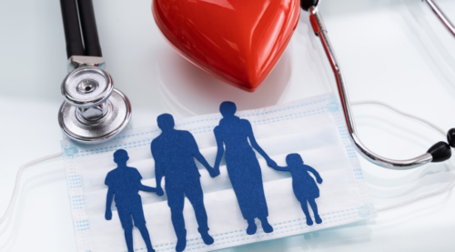 Family of four silhouette in blue on mask with stethoscope and red heart