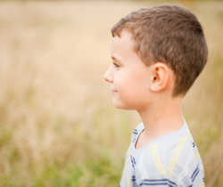 Boy in field of wheat