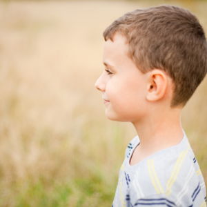 Boy in field of wheat